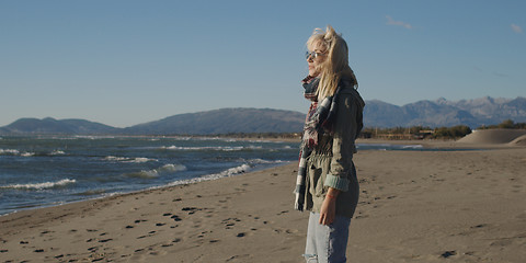 Image showing Young woman enjoying the warm autumn day