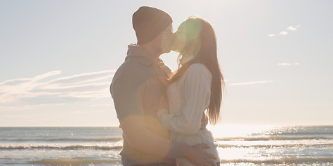 Image showing Couple having fun on beautiful autumn day at beach