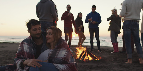 Image showing Friends having fun at beach on autumn day