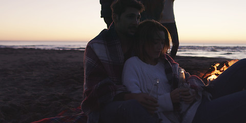 Image showing Friends having fun at beach on autumn day