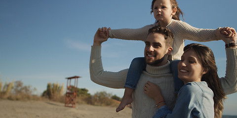 Image showing Young family enjoying vecation during autumn