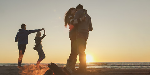 Image showing Friends having fun at beach on autumn day