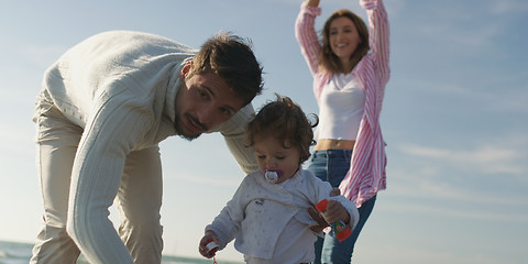 Image showing Young family enjoying vecation during autumn