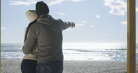 Image showing Couple having fun on beautiful autumn day at beach