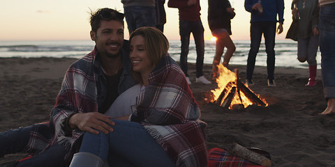 Image showing Friends having fun at beach on autumn day