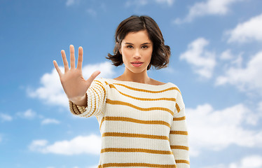 Image showing young woman making stopping gesture