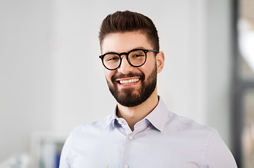 Image showing portrait of smiling bearded businessman in glasses