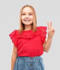 Image showing beautiful smiling girl showing peace sign