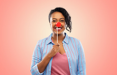 Image showing happy african american woman with red clown nose