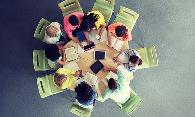 Image showing group of students with tablet pc at school library