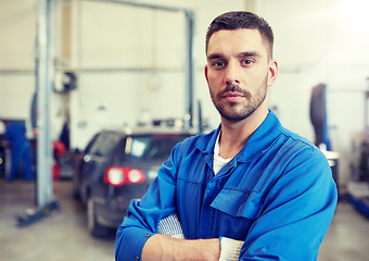 Image showing auto mechanic man or smith at car workshop