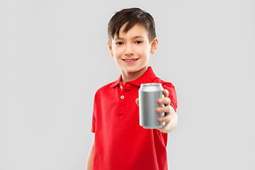 Image showing boy in red t-shirt drinking soda from tin can