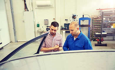 Image showing auto mechanic and man at car shop