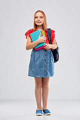 Image showing smiling student girl with books and bag