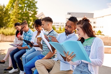 Image showing group of happy students with notebooks and drinks