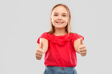 Image showing beautiful smiling girl showing thumbs up