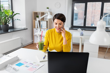 Image showing ui designer calling on smartphone at office