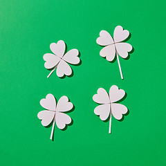 Image showing Four handmade shamrock\'s leaves with shadows.