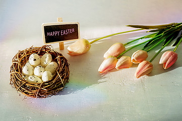 Image showing Easter eggs and tulips on wooden planks