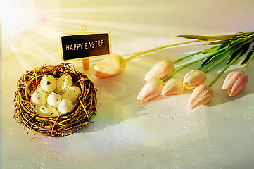 Image showing Easter eggs and tulips on wooden planks