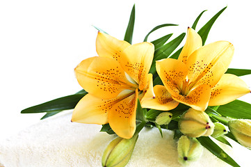 Image showing Stack of towels with flowers