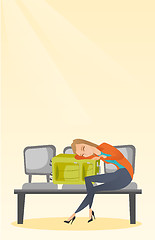 Image showing Tired woman sleeping on suitcase at the airport.