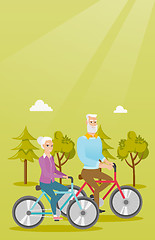 Image showing Happy senior couple riding on bicycles in park.