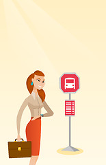 Image showing Caucasian woman waiting for a bus at the bus stop.