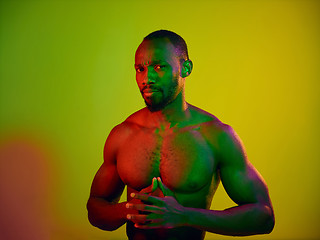Image showing Close up portrait of a young naked african man looking at camera indoors
