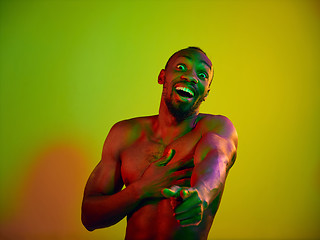 Image showing Close up portrait of a young naked african man looking at camera indoors