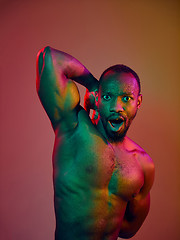 Image showing Close up portrait of a young naked african man looking at camera indoors