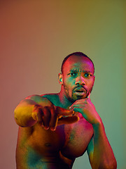 Image showing Close up portrait of a young naked african man looking at camera indoors