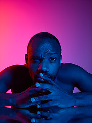 Image showing Close up portrait of a young naked african man looking at camera indoors