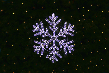 Image showing Beautiful christmas decoration, bright glowing snowflake