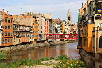 Image showing Colorful houses and Eiffel bridge on river Onyar in Girona