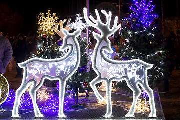 Image showing Wonderful holiday illumination of deer figures sparkling with bokeh lights