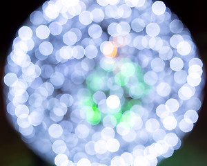 Image showing Magic bokeh lights of sparkling holiday illumination at night