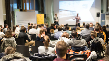 Image showing Business speaker giving a talk at business conference event.