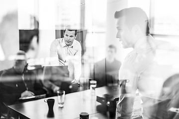 Image showing Business team brainstorming on meeting in modern corporate office.