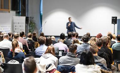 Image showing Business speaker giving a talk at business conference event.