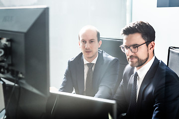 Image showing Business team analyzing data at business meeting in modern corporate office.