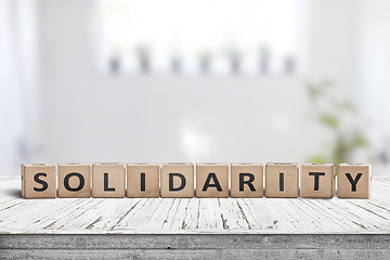 Image showing Solidarity message on a wooden table