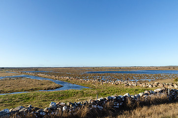 Image showing Flooded landscape with traditional dry stone walls