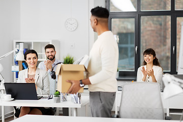 Image showing office workers applauding to male colleague