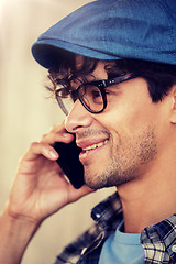 Image showing close up of hipster man calling on smartphone