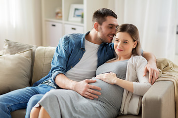 Image showing man hugging pregnant woman at home