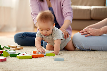 Image showing happy family with baby boy playing at home