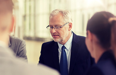 Image showing smiling business people meeting in office