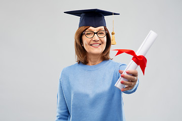 Image showing happy senior graduate student woman with diploma