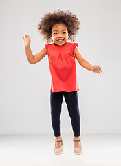 Image showing happy little african american girl jumping